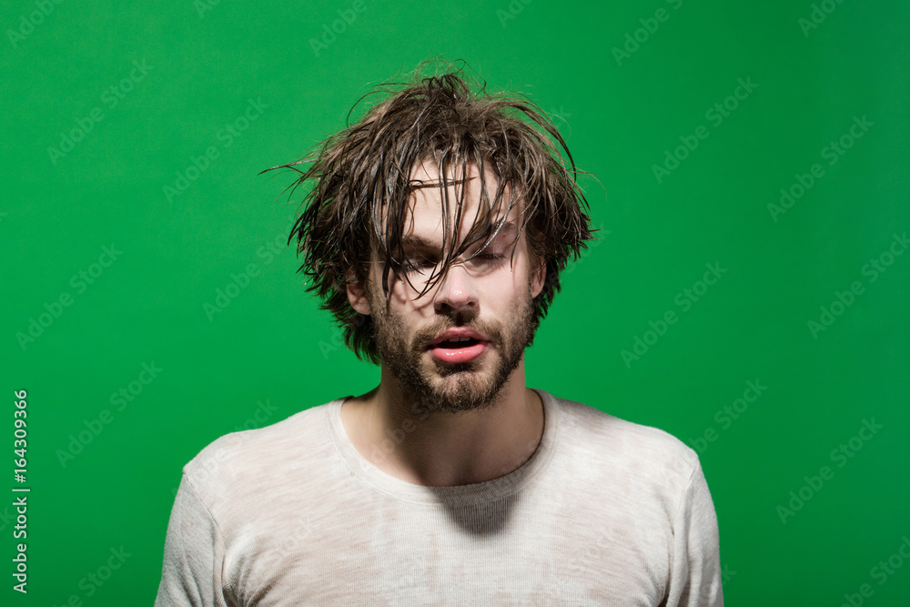 sleepy man with wet head, face and hair in morning sleepy man with wet head, face and hair in morning