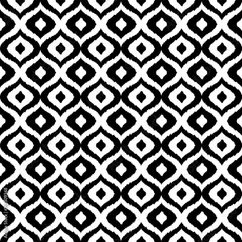 Black and white tribal vector seamless pattern. Hand drawn abstract background. Classic textile design, animalistic motif.