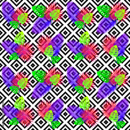 Tropical seamless pattern with exotic vivid leaves on black and white tribal ...