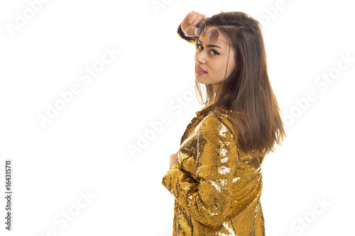 Elegant woman in golden jacket