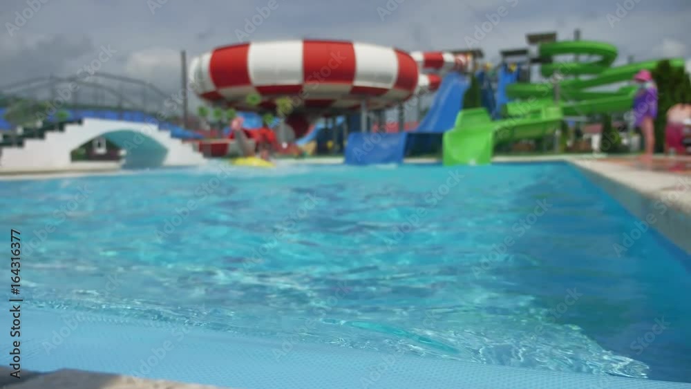 aquapark. water park people ride from the slides and jump into the pool lifestyle aquapark. water park people ride from the slides and jump into the pool lifestyle