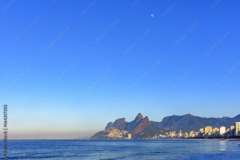 Moon over Ipanema beach in Rio de Janeiro at morning Moon over Ipanema beach in Rio de Janeiro at morning