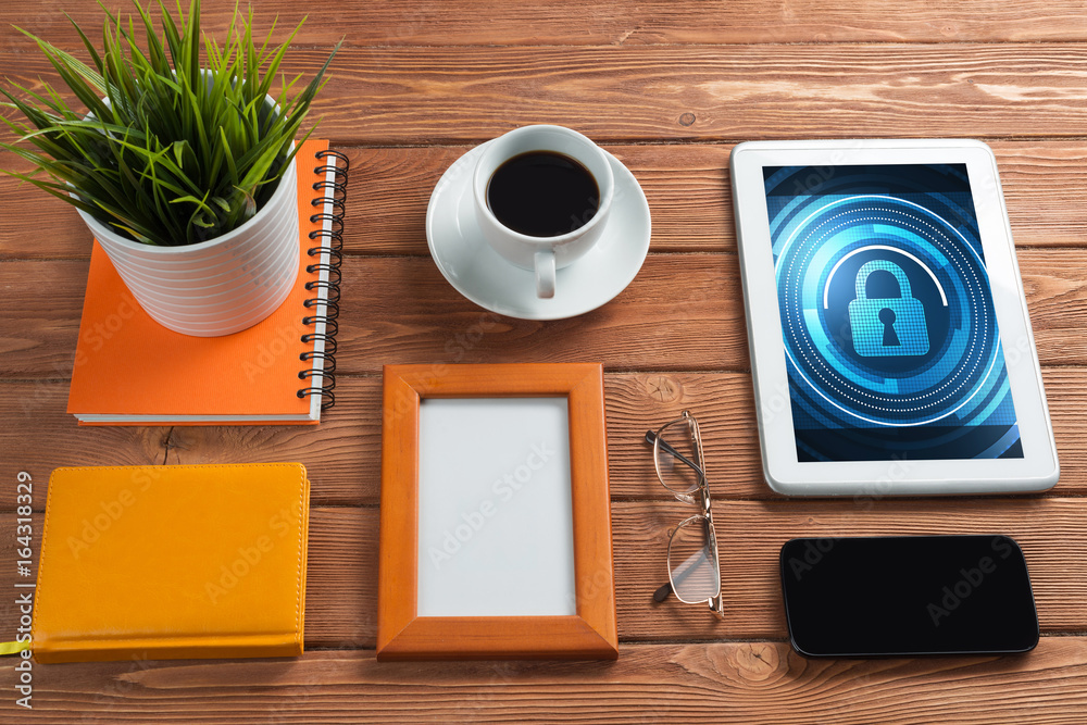 Web security and technology concept with tablet pc on wooden table Web security and technology concept with tablet pc on wooden table