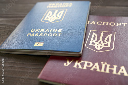 two versions of Ukrainian passport red and blue documents