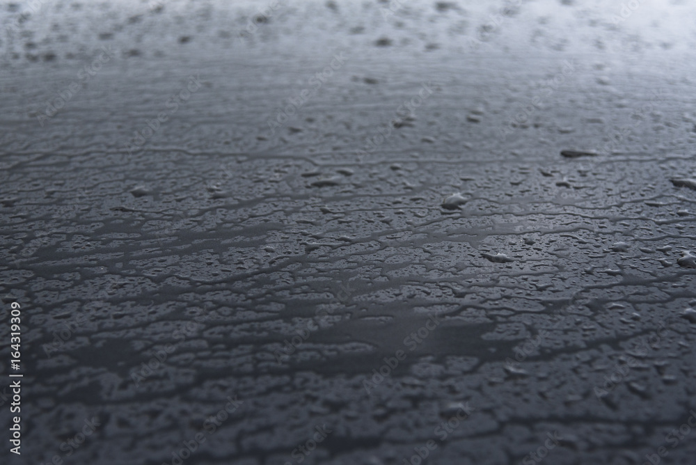 Drops of water at car hood, background Drops of water at car hood, background