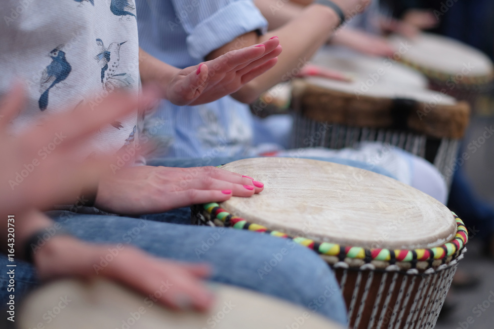 Speech by a group of girls playing ethnic drums at a concert of percussion music Speech by a group of girls playing ethnic drums at a concert of percussion music
