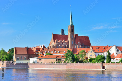 View on Church of the Holy Cross and St. Bartholomew, Odra river and Tumski Island, Wroclaw, Poland.