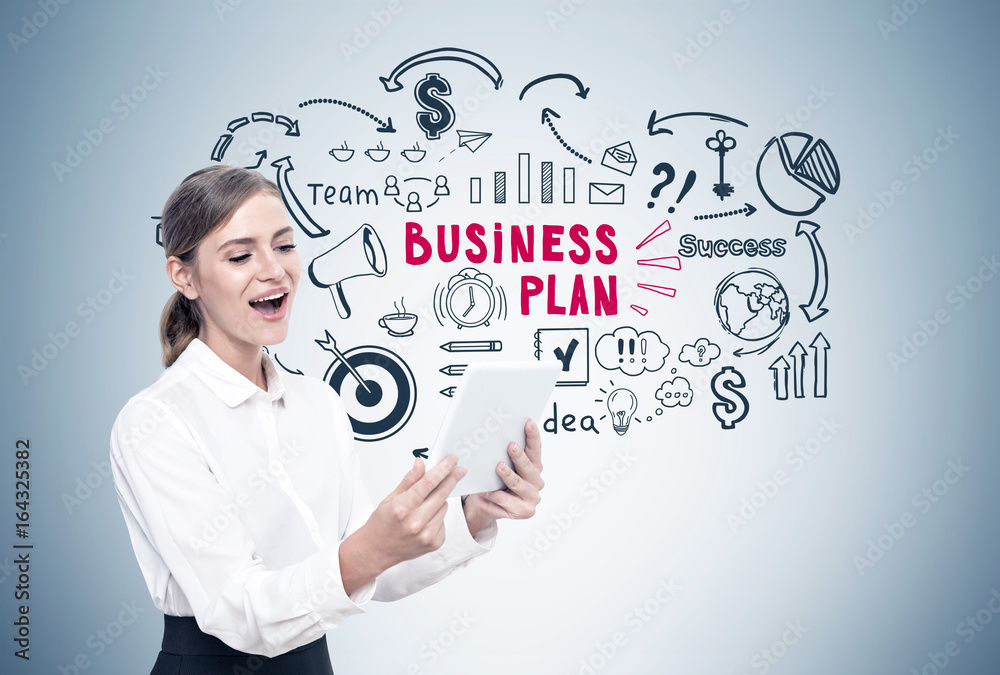 Happy blond woman with a tablet, business plan Happy blond woman with a tablet, business plan