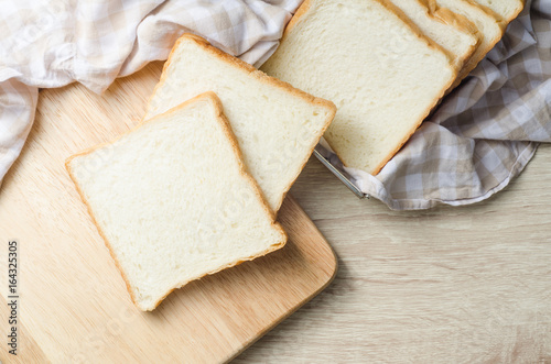 White bread on wood table for morning breakfast