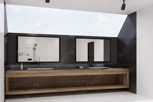 Black tiled bathroom interior  sinks  side