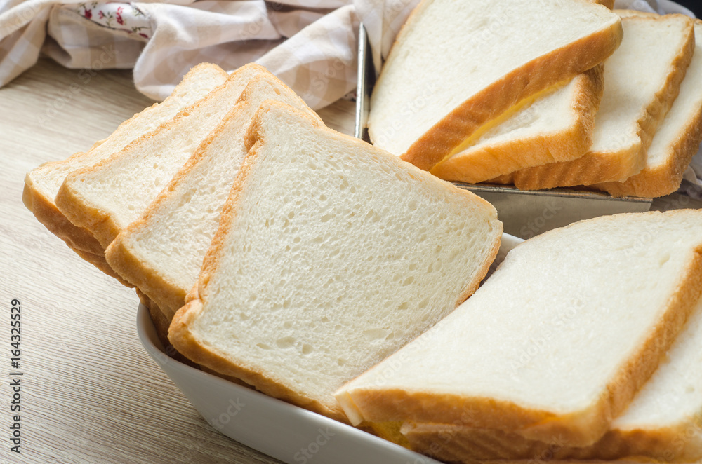 White bread on wood table for morning breakfast White bread on wood table for morning breakfast