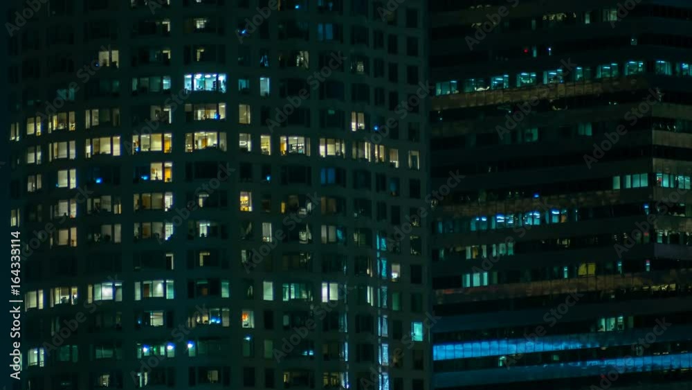 City Working Late Time-lapse. Office lights blink on and off at the end of a long and busy work day in downtown Los Angeles, California. City Working Late Time-lapse. Office lights blink on and off at the end of a long and busy work day in downtown Los Angeles, California.