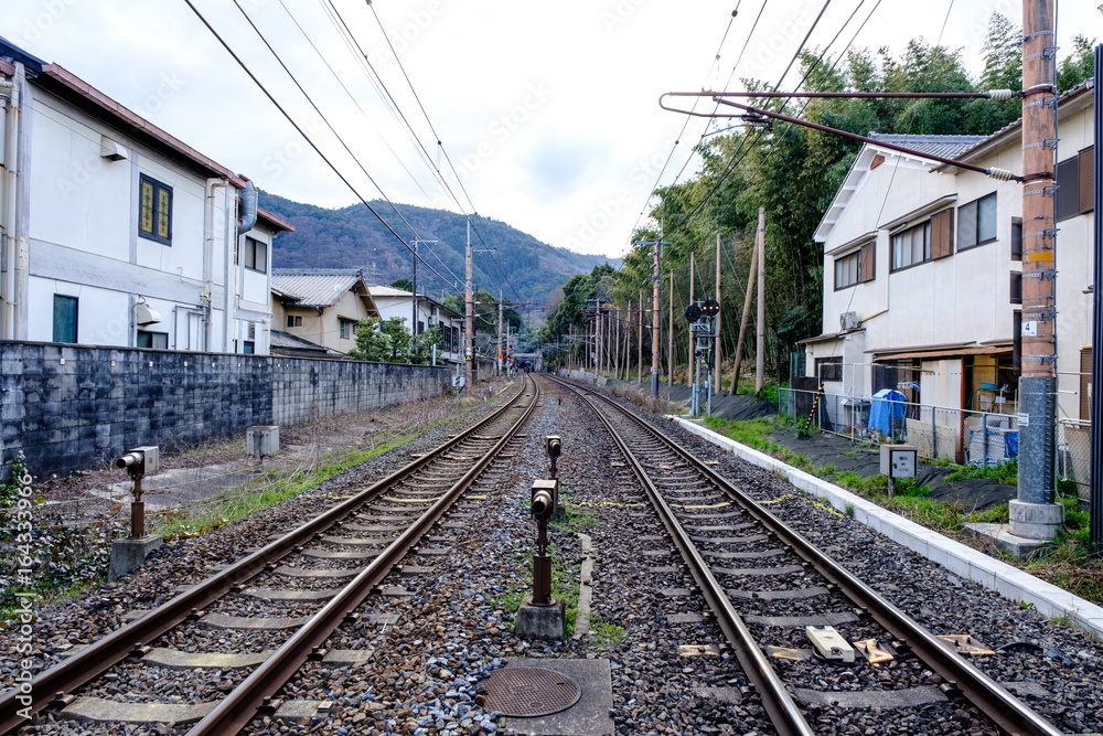 Railroad tracks with Cityscape and cloudy sky in Japan