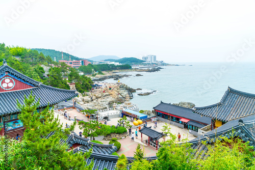 BUSAN,SOUTH KOREA-July 11,2017: Tourist visits Haedong Yonggung Temple is a Buddhist temple and large one and Temple sits upon a cliff overlooking the East Sea in Busan. photo