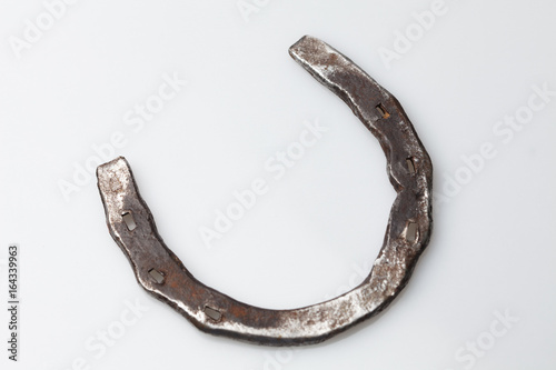 An old horseshoe on a white background