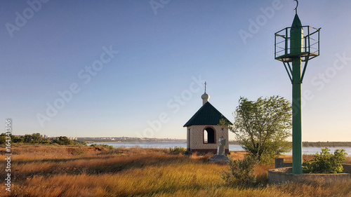 Church on the shore of the Volga river in the sun