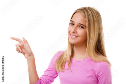Attractive young girl poiting her finger.Isolated