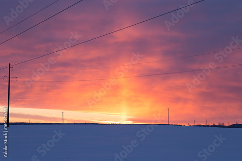 a power line frosty winter sunset