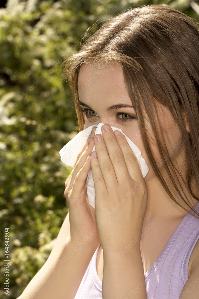 Attractive young woman outdoor with white tissue Attractive young woman outdoor with white tissue