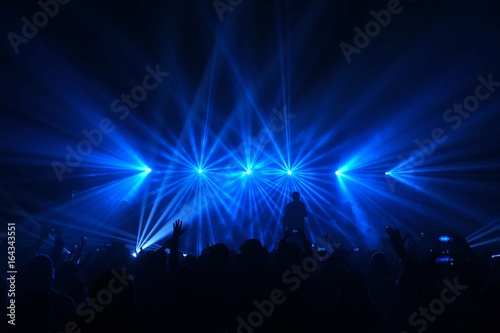 Concert under blue star flares