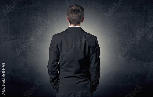 Businessman standing and thinking