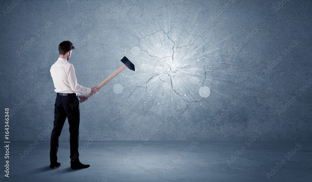 Man hitting wall with sledgehammer hi-res stock photography and