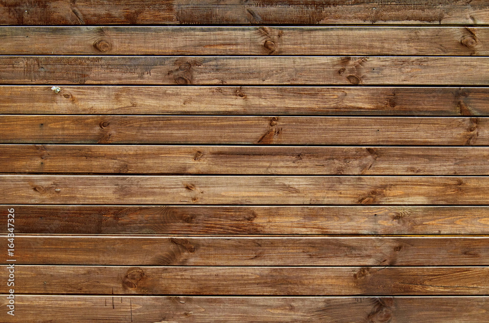 Background of natural knotted wood fence. Wooden texture. Background of natural knotted wood fence. Wooden texture.