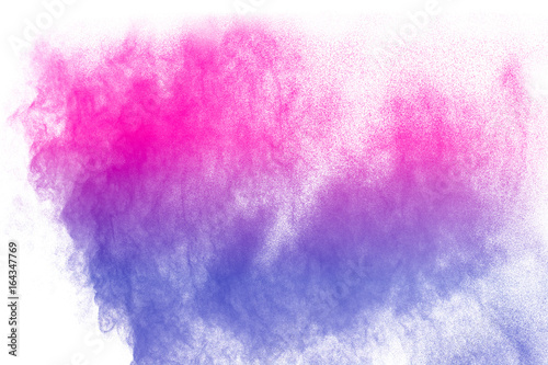 abstract pink-purple powder splatted on white background,Freeze motion of pink-purple powder exploding on white background. © Pattadis