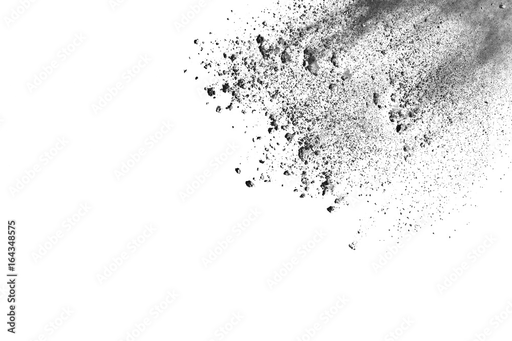 Obraz premium Black powder explosion. Closeup of black dust particles explode isolated on white background.