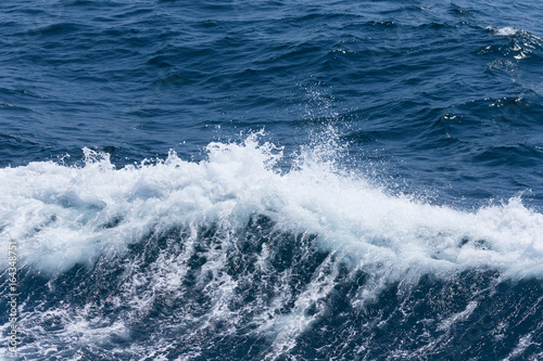 White crest of a sea wave. Selective focus. Shallow depth of field