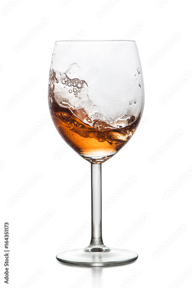 Splashing drink in glass Splashing drink in glass