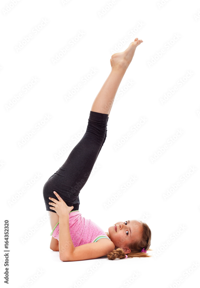 Young girl doing the candle gymnastic exercise Young girl doing the candle gymnastic exercise