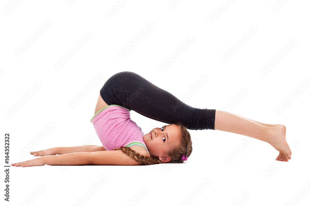 Young girl doing flexibility gymnastic exercise Young girl doing flexibility gymnastic exercise