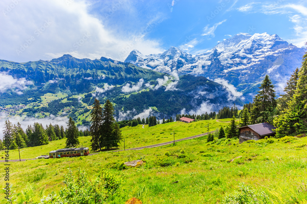Majestic panoramic view of Eiger, Monch, Jungfrau mountains from Murren-Gimmelwald trail, Swiss alps, Bernese Oberland, Berne Canton, Switzerland, Europe. Great outdoor trail start from Lauterbrunnen.