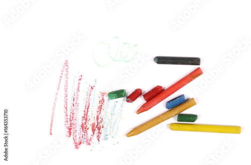 Grunge wax pastel crayons and drawings isolated on white background
