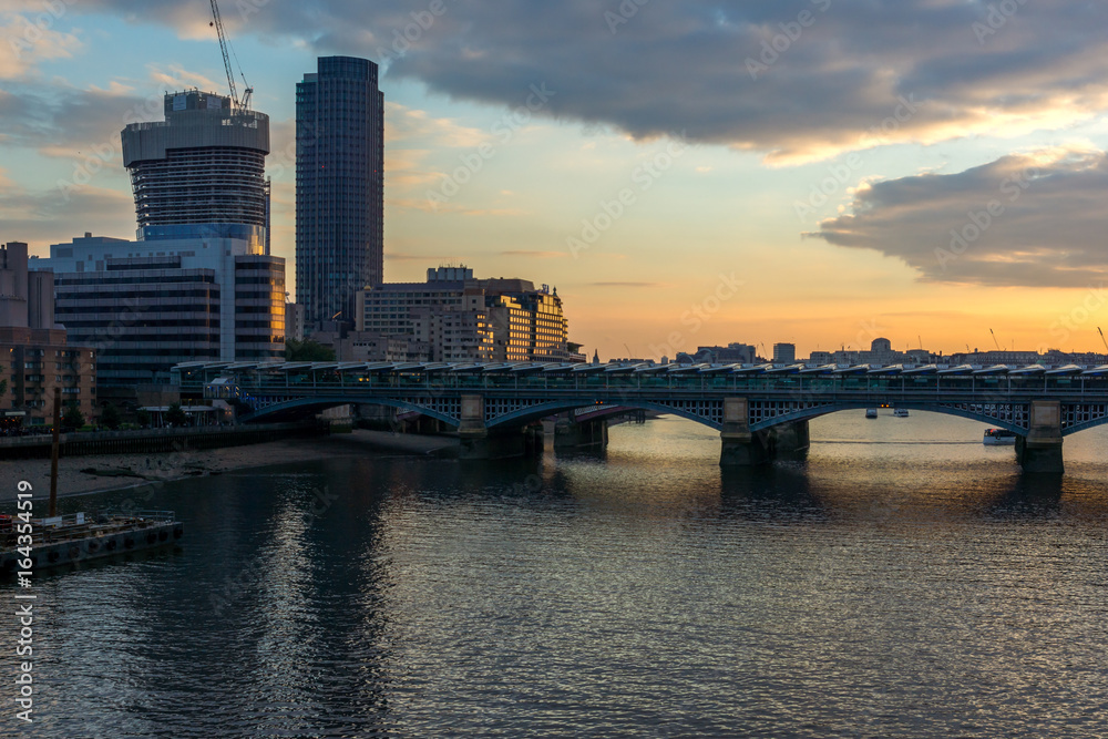 Fototapeta premium Amazing sunset Cityscape from Millennium Bridge and Thames River, London, Great Britain