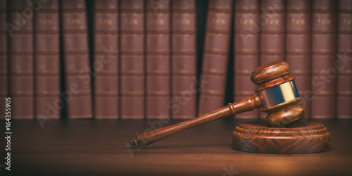 Wallpaper Mural Gavel on the background of vintage lawyer books. Concept of law and justice. Torontodigital.ca