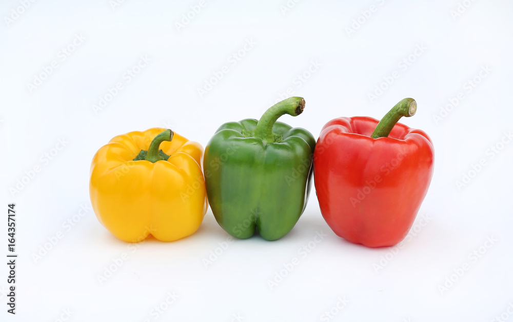 Green, red and yellow bell pepper isolated on white background. Green, red and yellow bell pepper isolated on white background.
