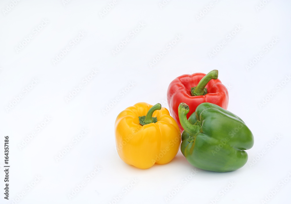 Green, red and yellow bell pepper isolated on white background. Green, red and yellow bell pepper isolated on white background.