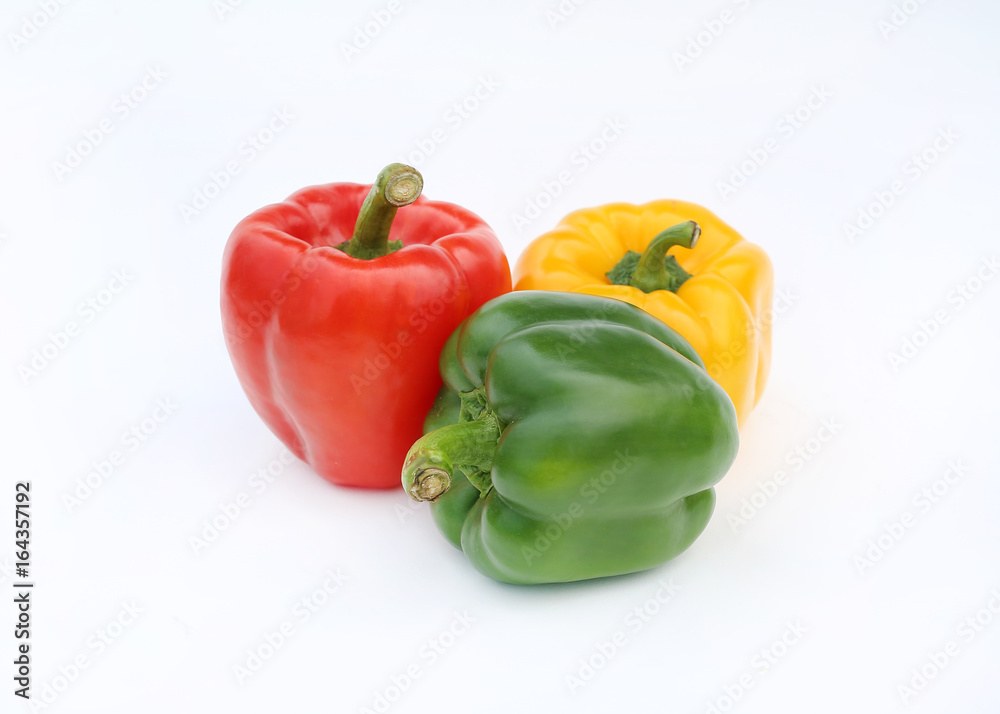 Green , red and yellow bell pepper isolated on white background. Green , red and yellow bell pepper isolated on white background.