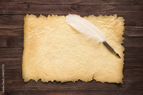 White feather and old paper...