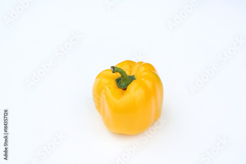 Yellow bell pepper isolated on white background.