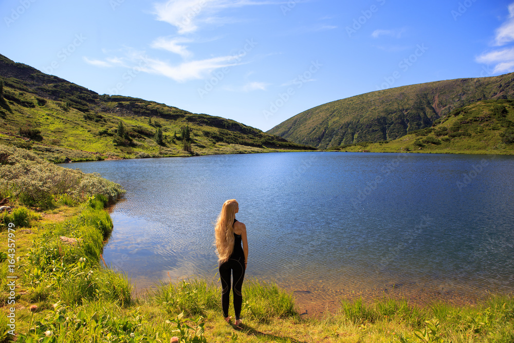 Girl on mountain lake