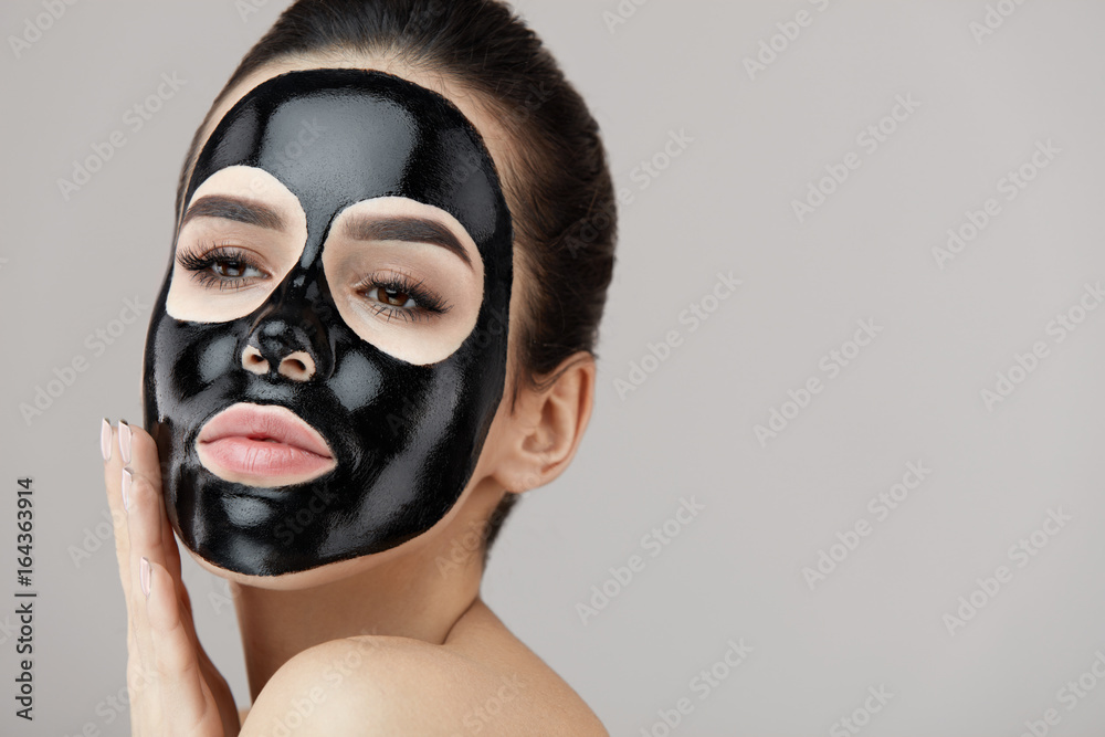 Female Beauty Face Skin Masking. Girl With Black Peeling Mask