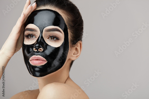 Female Beauty Face Skin Masking. Girl With Black Peeling Mask