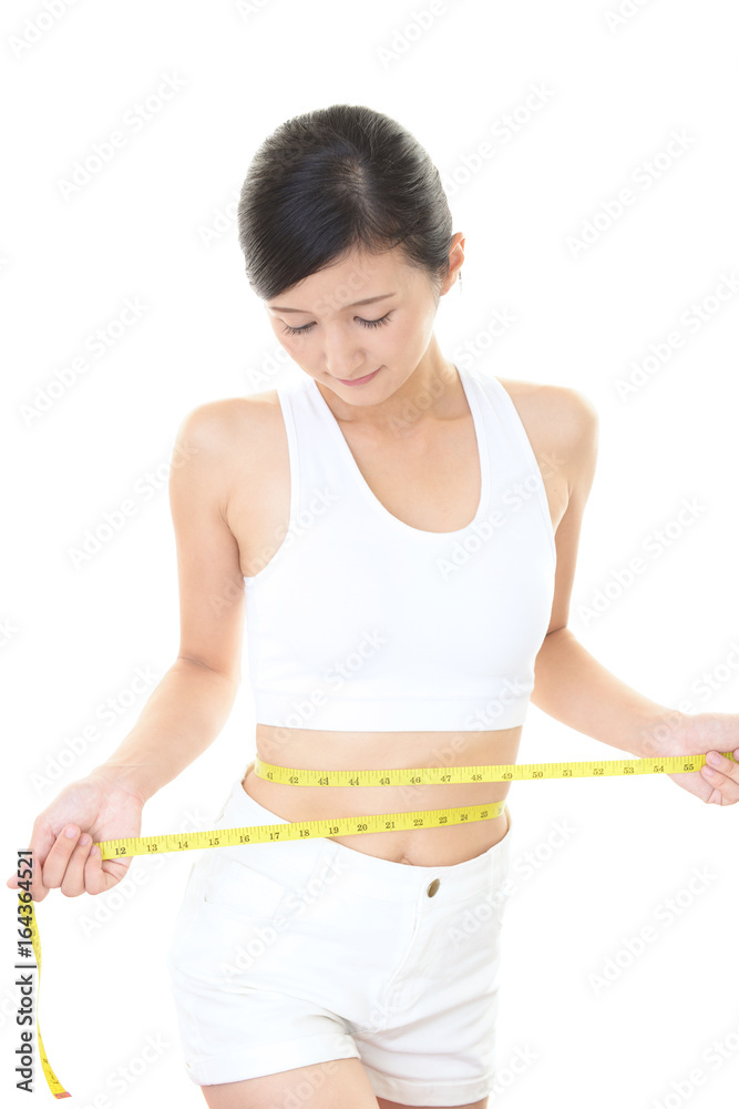 腹囲を測る女性 腹囲を測る女性