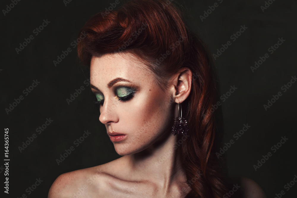 Beauty portrait of a beautiful redhead girl with bright make-up Beauty portrait of a beautiful redhead girl with bright make-up