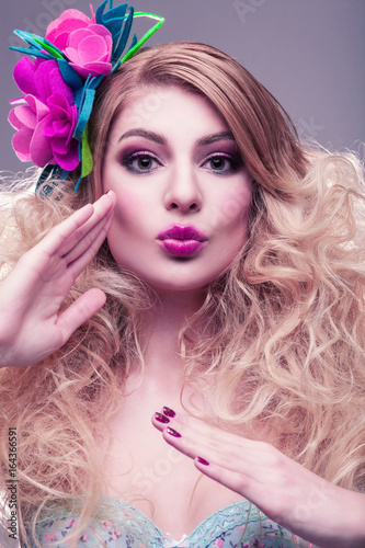 Beauty portrait of beautiful blonde girl with bright pink make-up