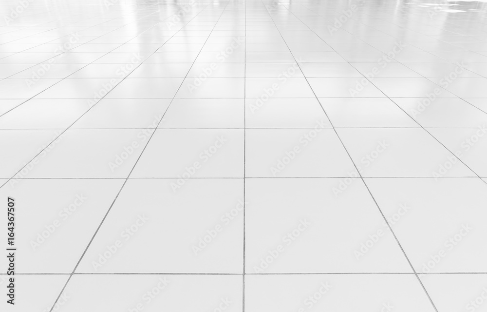 White tile floor background in perspective view. Clean, shiny, symmetry  with grid line texture. For decoration in bathroom, kitchen and laundry  room. And empty or copy space for product display also. Stock