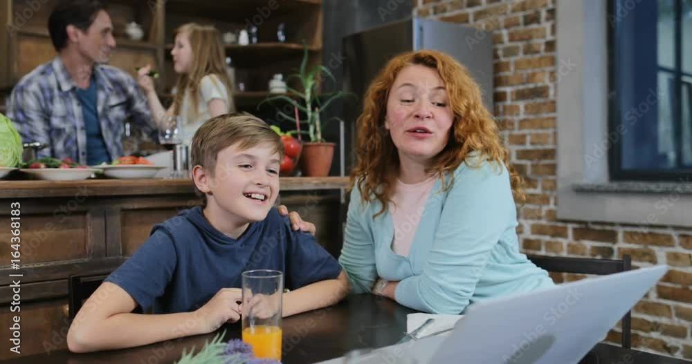 Mother And Son Talking Make Video Call Using Laptop Father And Daughter Cooking Food In Kitchen Together Slow Motion 60 Mother And Son Talking Make Video Call Using Laptop Father And Daughter Cooking Food In Kitchen Together Slow Motion 60